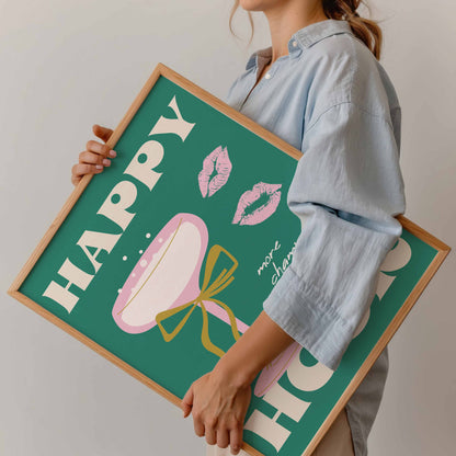 Person holding a framed decorative sign with 'Happy' and lip designs.